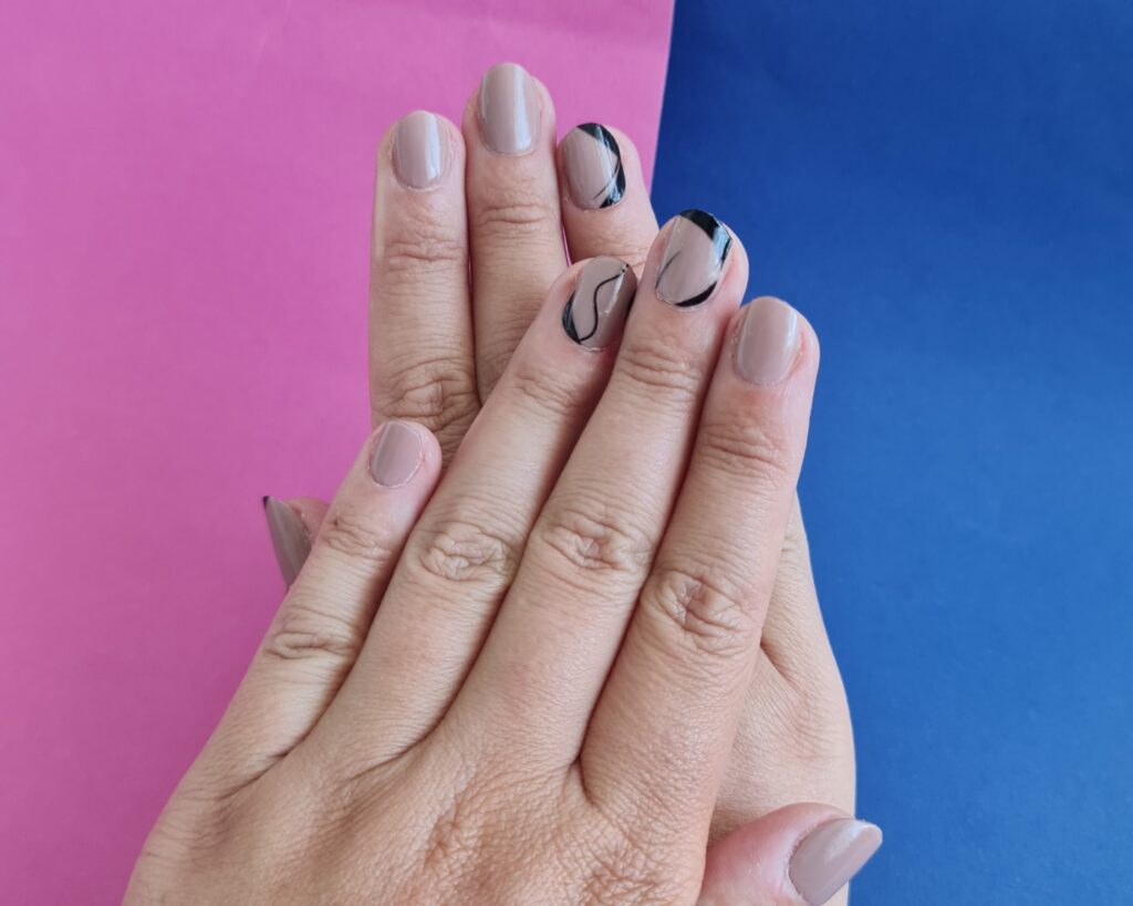 A manicure with two stickers at once makes the world of nail art endless.